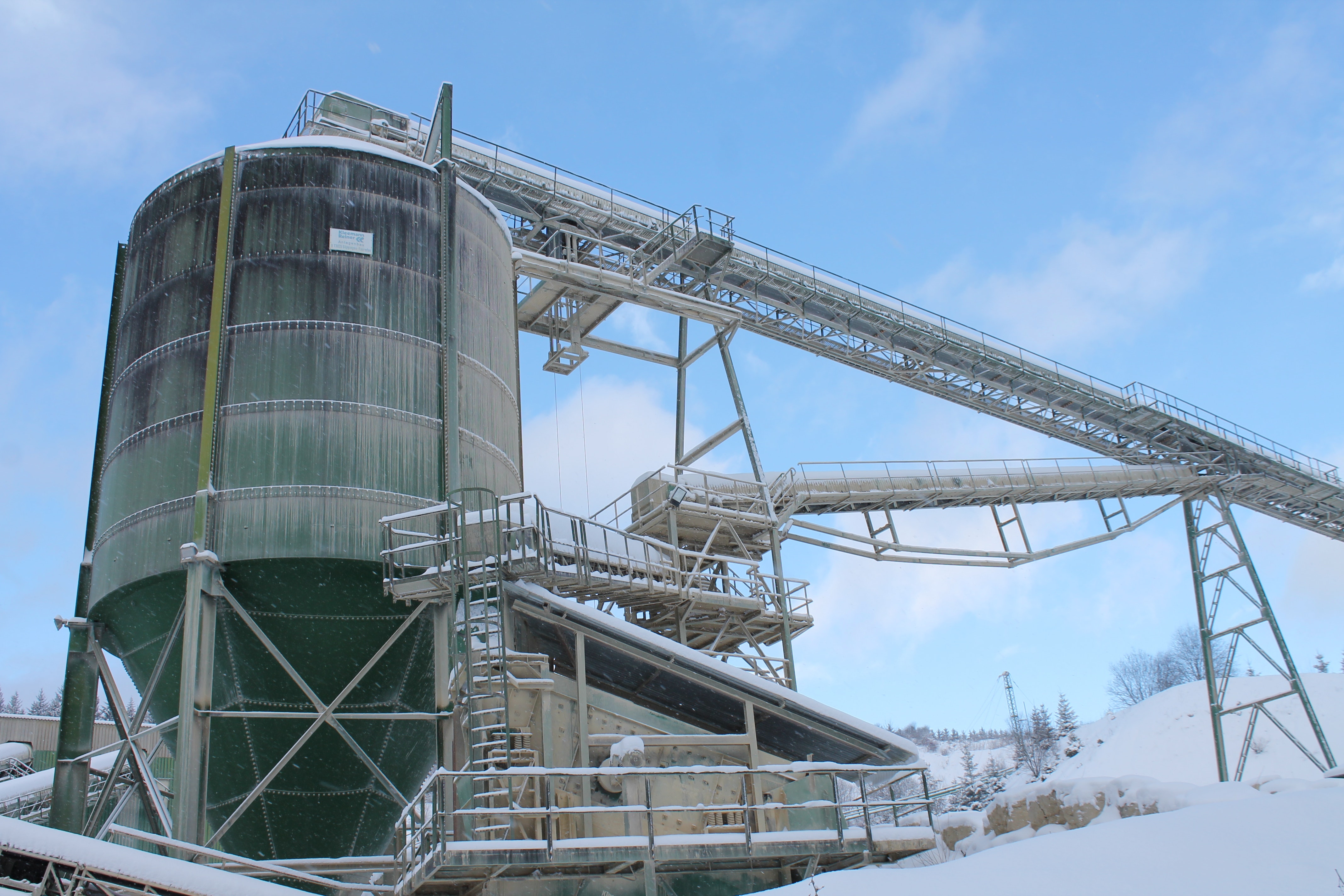 storage tanks covered in snow